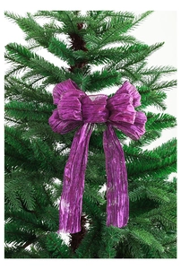 Detail of purple glitter bow ornament with metallic texture on green Christmas tree branch