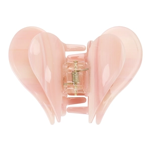 Detailed view of pink heart-shaped acetate hair claw clip with silver metal spring