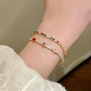 Macro view of adjustable gold plated bracelets with vibrant multi-color zircon gemstones
