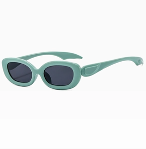 Detail view of mint green Y2K oval sunglasses with sleek temples and dark lenses