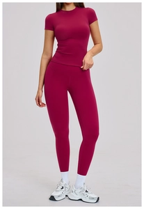 Macro detail of dark magenta yoga set featuring breathable high-stretch athletic fabric