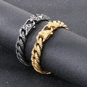 Close-up of hammered texture on gold and silver Cuban chain bracelet for men