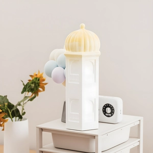 Detail of European castle tower resin mold showing ornate white archways and warm LED light