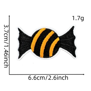 Halloween candy embroidered patch in black and yellow stripes with white borders 6.6cm