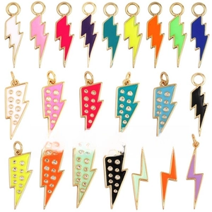 Close-up of colorful lightning bolt pendants with enamel and zircon inlay detail