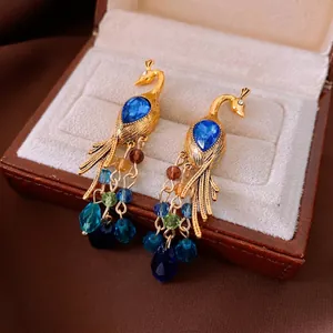 Vintage style peacock crystal drop earrings with blue gemstones and colorful beaded tassels