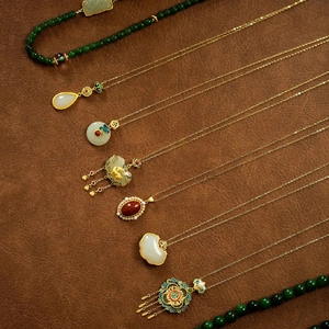 New Chinese style pearl necklaces with natural stones and gold pendants on dark leather