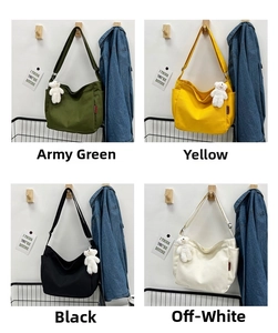 Detail of canvas crossbody bags in four colors with cute white bear doll charms