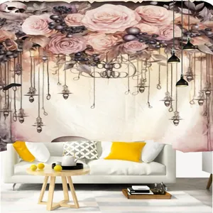 Detail of vintage forest tapestry with pink roses and hanging lamps over a white sofa