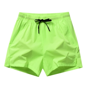 Quick-dry neon green athletic shorts with elastic drawstring waist and side slits