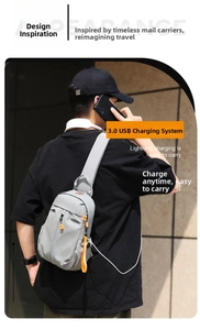 Detail of grey waterproof chest bag with orange zipper and USB charging port outdoors