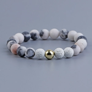 Pink zebra stone bracelet with gold beads and white porous lava rock for women