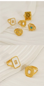 Detail of vintage geometric 18k gold plated stainless steel rings with shell inlays