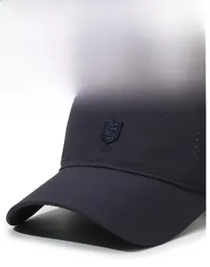 Detail of breathable quick-dry mesh fabric and shield S logo on a navy baseball cap