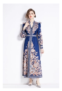 Detail of vintage paisley print on long-sleeved V-neck dress with cinched waist