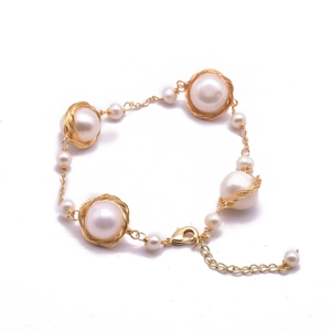 Elegant natural freshwater pearl bracelet with gold wire wrap design and lobster clasp
