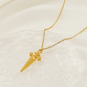 Minimalist gold stainless steel necklace featuring a vintage dagger cross pendant design