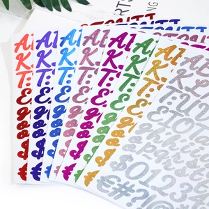Macro view of colorful glitter alphabet and number stickers for DIY craft decoration