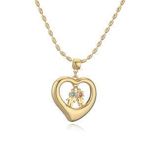 Golden heart pendant necklace with boy and girl charms on a beaded chain