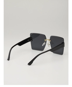 Detailed back view of oversized square sunglasses featuring gold bridge and black temples