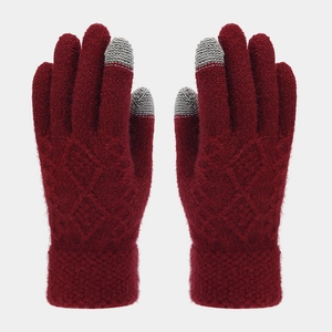 Detail of burgundy winter knit gloves with touch screen fingers and diamond pattern