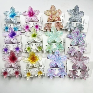 Vibrant gradient plumeria flower hair claw clip set for tropical beach vacations