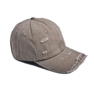 Close-up of distressed ripped details on vintage washed cotton twill baseball cap