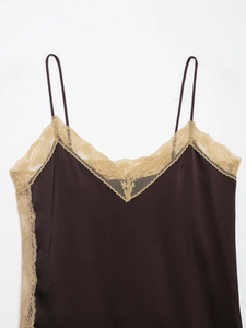 Close-up of brown satin camisole top with delicate beige lace trim and smooth texture
