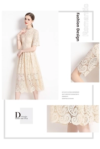 Detailaufnahme der floralen Stickerei und Häkelspitze an einem beigen Midi-Kleid
