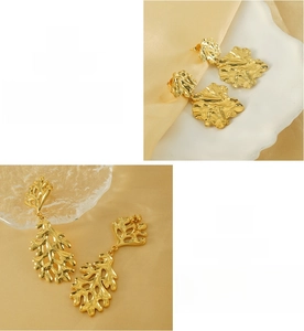 Detail of 18K gold plated stainless steel irregular lava and hollow leaf drop earrings
