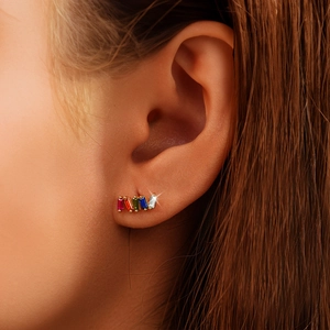 Macro view of geometric S925 silver long earrings with multi-colored square crystals