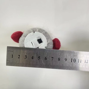 Base detail of glowing Christmas gnome showing ON/OFF switch and 7cm width measurement