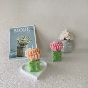 Tulip bouquet scented candles with pink floral tops and green ribbon base for home decor