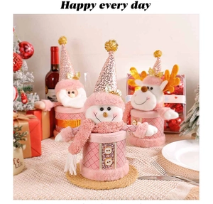 Close-up of pink Christmas candy jars featuring snowman, reindeer and Santa designs