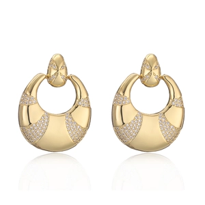 Elegant gold plated crescent earrings with sparkling zircon crystals on white background