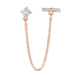 Macro view of rose gold chain earring featuring sparkling cubic zirconia studs