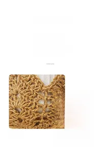 Detail of handcrafted macrame plant hanger featuring wave-patterned woven texture