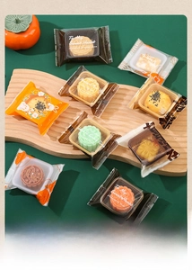 Detailed view of assorted mooncake packaging bags with colorful Chinese patterns