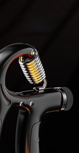 Detailed close-up of thick stainless steel spring on adjustable hand grip strengthener