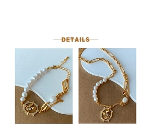 Detail of freshwater pearl necklace with gold tulip pendant and crystal inlay