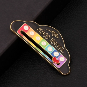 Detailed macro view of the sliding rainbow heart pointer on the black cloud mood tracker pin