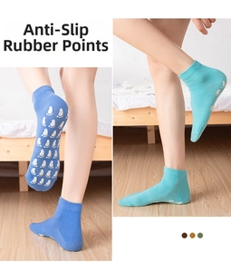 Detail showing non-slip silicone grip dots on the sole of cotton yoga trampoline socks