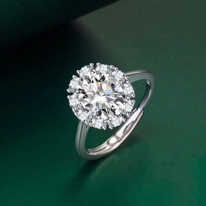 Adjustable sterling silver halo ring with large round crystal and claw set accents