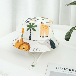 White cotton kids bucket hat with colorful cartoon animal prints and adjustable chin strap