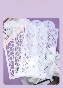Detailed view of hollow stencils with numbered geometric and leaf patterns for cake baking