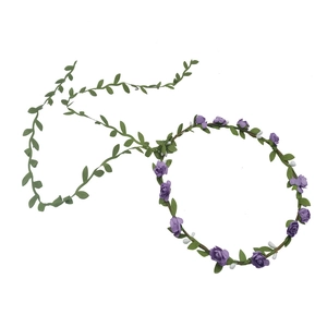 Detail showing purple roses and green leaves on a woven bridal flower wreath headband