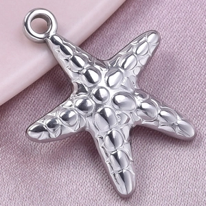 Macro shot of silver 304 stainless steel starfish pendant with textured crocodile pattern