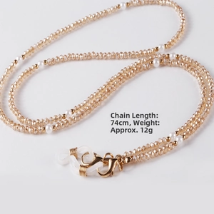 Detailed macro view showing the 74cm pearl and crystal beaded glasses chain components