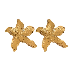 Golden fan-shaped flower earrings with vintage hammered texture on white background