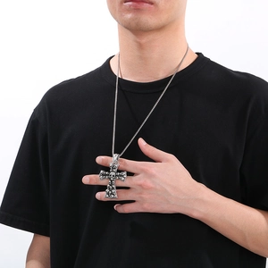 Vintage silver skull cross pendant necklace on model with stainless steel chain